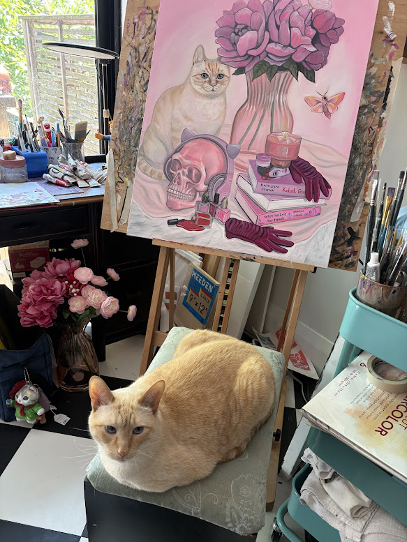 Studio view with a pink vanitas painting on an easel